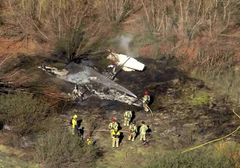Plane crashes into woods near airport in California, number aboard