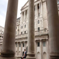 Bank of England cuts rates but sees higher inflati...